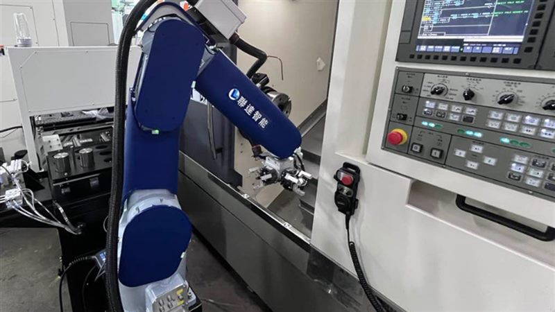 Vision-guided robot tending a machine tool